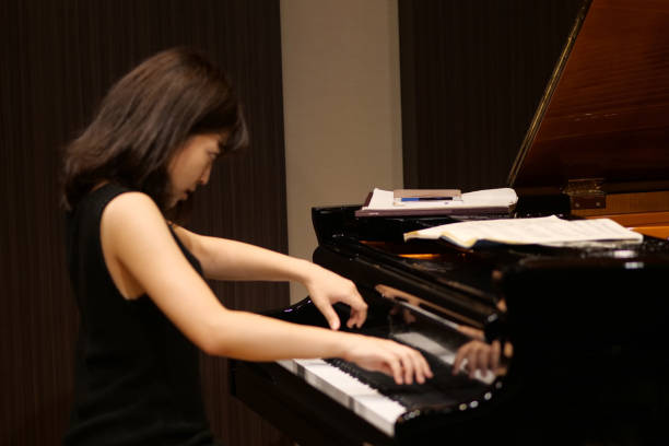 istock Pianist palying music at small room 1127063361
