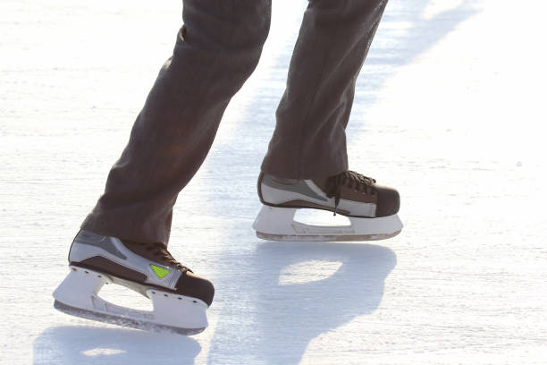 istock Feet skating on the ice rink 1127063528