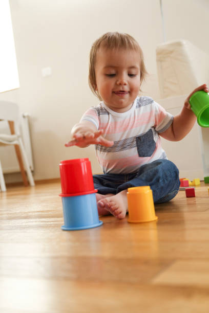 istock Little boy building tower on the floor 1127063726