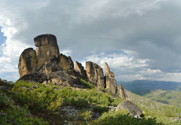 Stitched Panorama. Neighborhood of the village of Ust-Nera. Oymyakon. Sarychev's ridge with "kisilyakh" ("stone people") stock photo