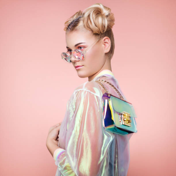 Blonde young woman in holographic jacket