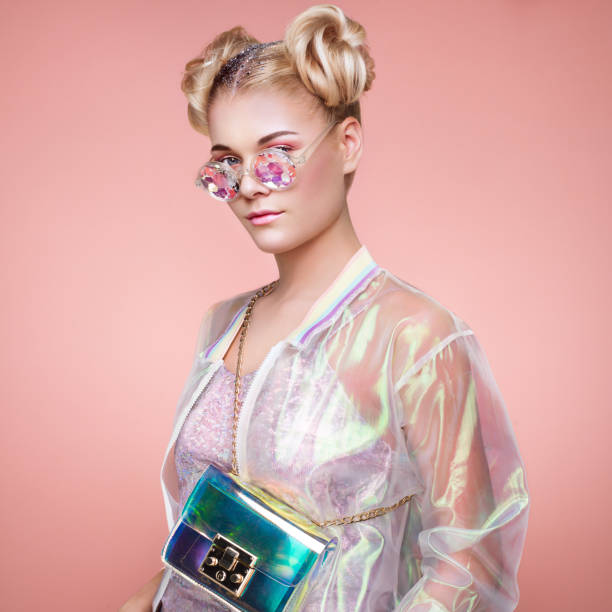 istock Blonde young woman in holographic jacket 1127065376