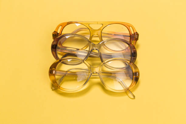 istock The combination of old glasses on yellow 1127066328