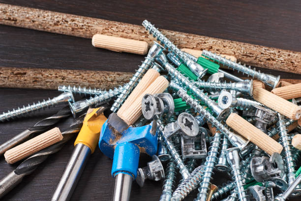 istock Tools for furniture assembly on a wooden background closeup 1127066486