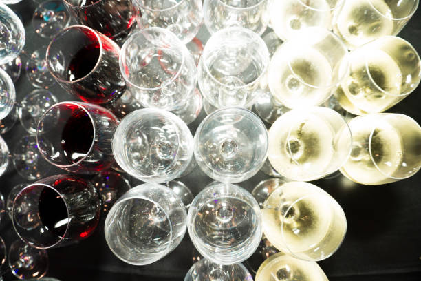 istock Many Empty Wine Glass in order on table and yellow 1127067350
