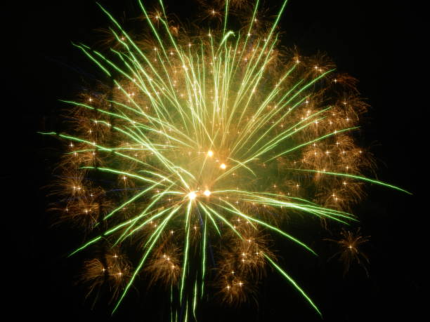 istock Fireworks - green yellow golden 1127067362