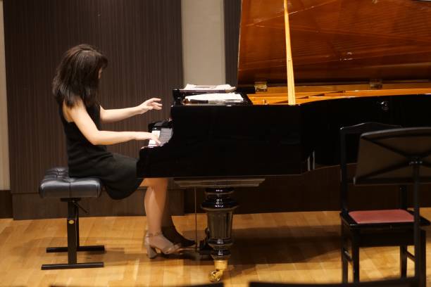 istock Pianist palying music at small room 1127069450