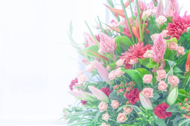 Pink alstroemeria flowers with green leaves in bouquet