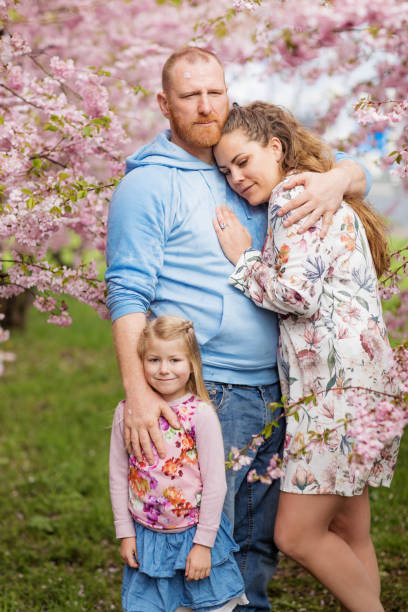 istock Beautiful dutch family in Cherry Blossom Forest 1127070749