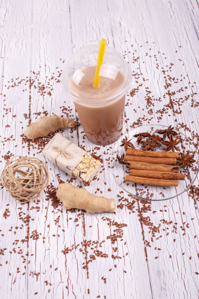 istock healthy brown smoothie with ginger and cinnamon sticks lie on th 1127070836