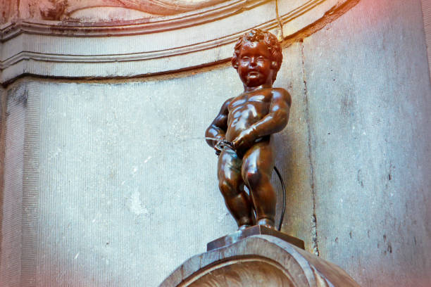 Manneken Pis little boy sculpture in Brussels Famous Manneken Pis sculpture in the City of Brussels manneken pis statue in brussels belgium stock pictures, royalty-free photos & images