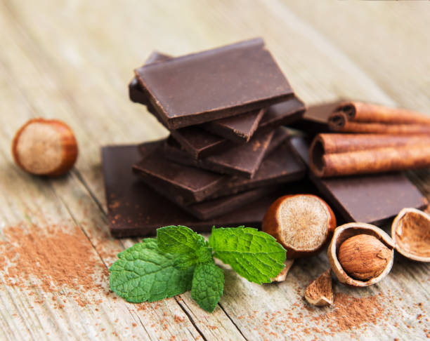 istock Chocolate with hazelnuts on a old wooden table 1127072400