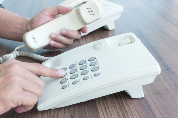 istock manager hand holding a phone and press a button number 1127073453