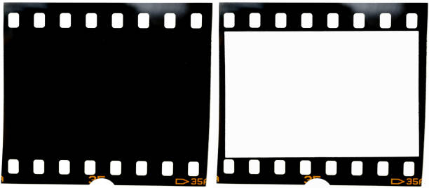 istock real 35mm film strip on white background with and without blank or empty picture frame, real macro photo of 135 film material, no scan, film texture 1127075350