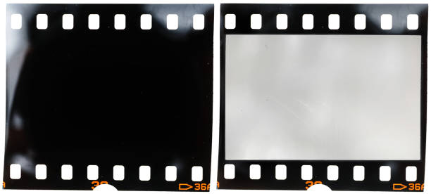 istock real 35mm film strip on white background with and without blank or empty picture frame, real macro photo of 135 film material, no scan, film texture 1127075372
