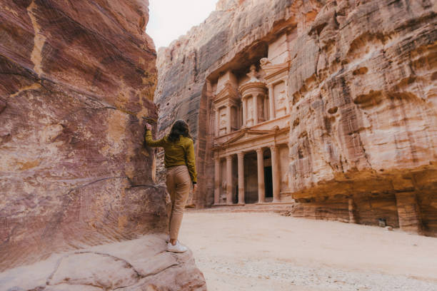 istock Woman looking at Al-Khazneh in Petra 1127076473