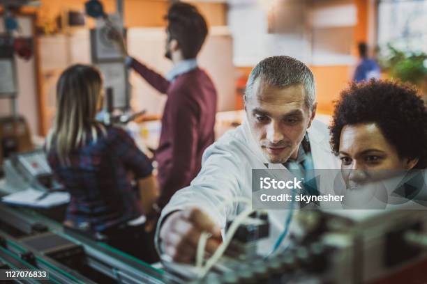 Working On Test Machine In Laboratory Stock Photo - Download Image Now ...