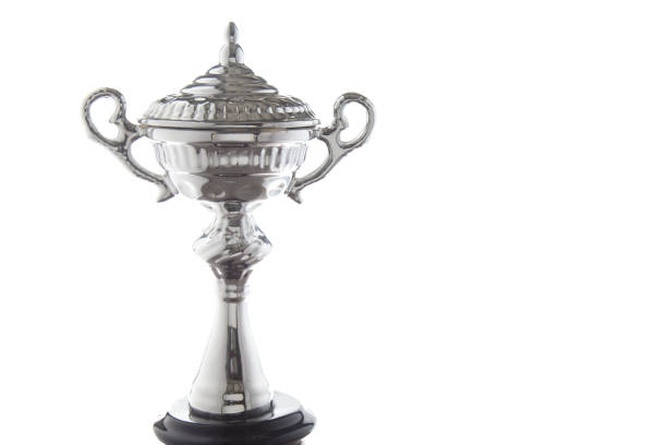 istock Close up of silver trophy isolated on white background. Winning awards with copy space 1127079045