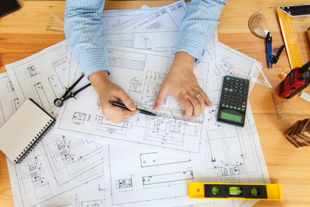 istock Engineer man working in the office, Drawing the construction project. Top view 1127079437