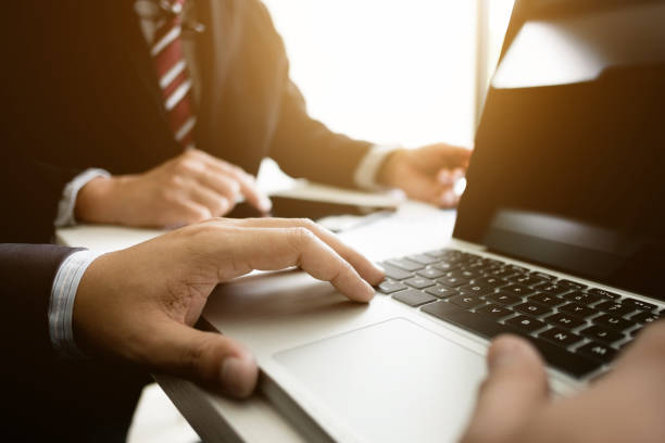 istock Business colleagues meeting annual sales performance and analyzing reports on laptop at a workplace 1127079440