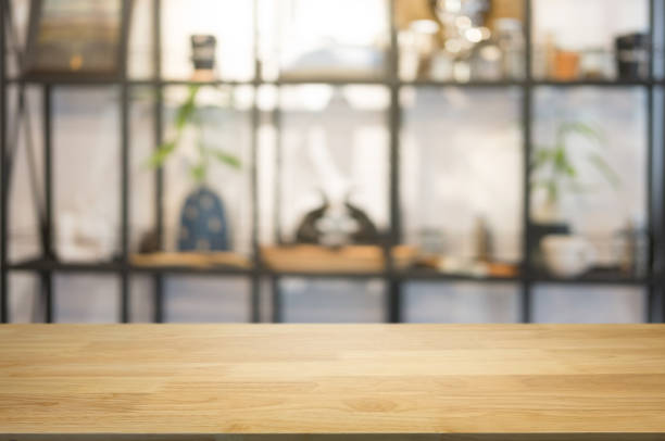 istock wooden table with blurred montage coffee shop cafe background. 1127079479
