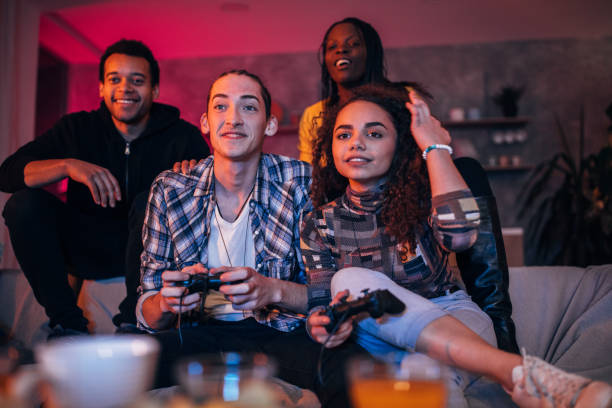 istock Young friends playing video games 1127080657