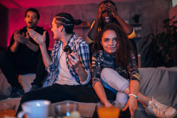 istock Young friends playing video games 1127081782