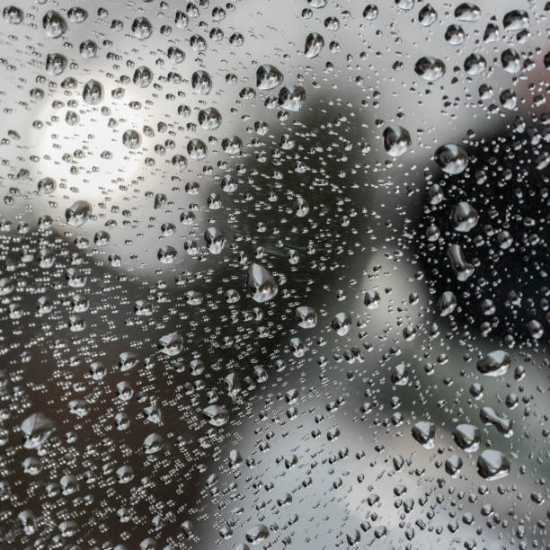 istock raindrops on glass pane of car window 1127082580