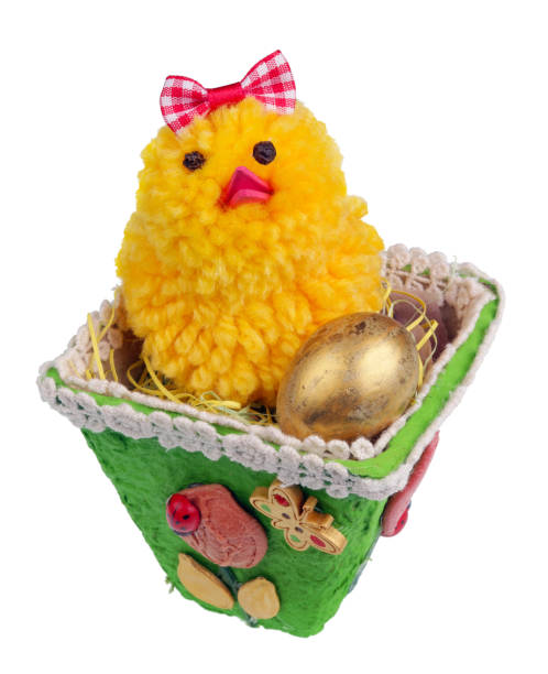 istock Easter handmade  nest from paper with funny chicken and golden egg. Isolated 1127082692