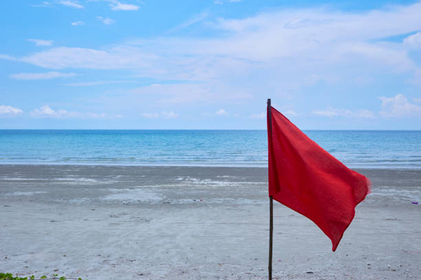 istock Red flag with the sea, Signal warning. 1127082856