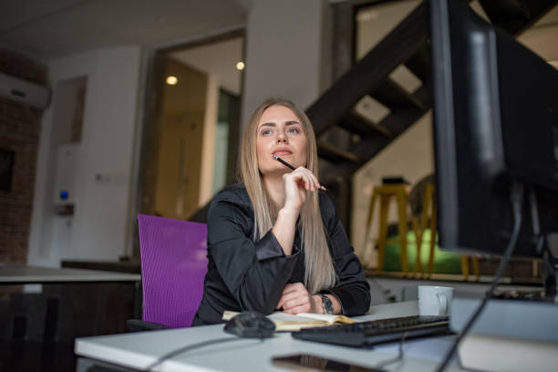 A businesswoman records business plans in the office. stock photo