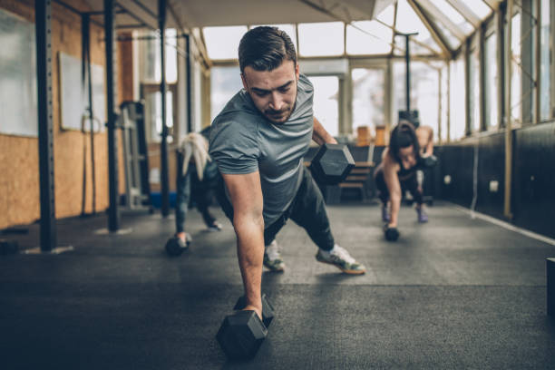 istock Personal Weight Training In The Gym 1127084814
