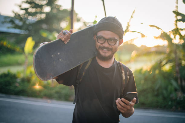 istock Skater boy with phone 1127085380