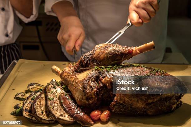 Carving Lamb Stock Photo - Download Image Now - Large, Lunch, Baked