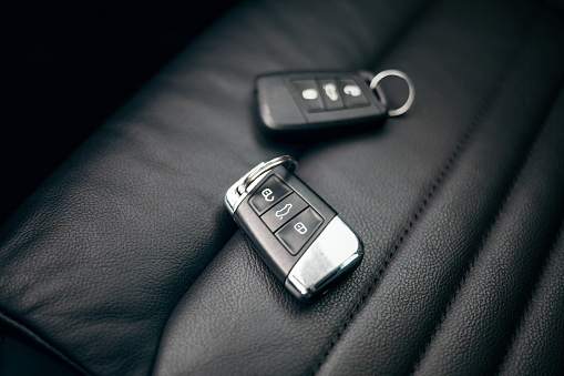 Car ignition key at leather seats