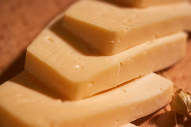 istock Traditional Dutch semi hard cheese served close up on rural table with sacking. Selective focus 1127087753