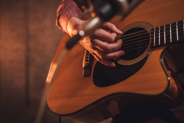 istock Man playing acoustic guitar 1127087960