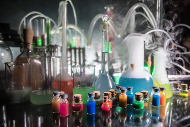 istock Pharmacy and chemistry theme. Test glass flask with solution in research laboratory. Science and medical background. Laboratory test tubes on dark toned background 1127088558