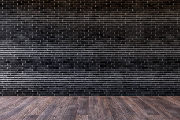 istock Loft interior with blank black brick wall and wooden floor. 3d render illustration mock up. 1127088875