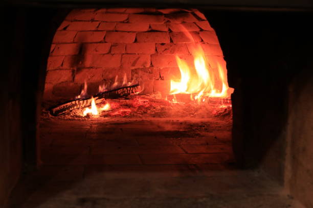 istock Baking italian pizza in brick oven 1127088955