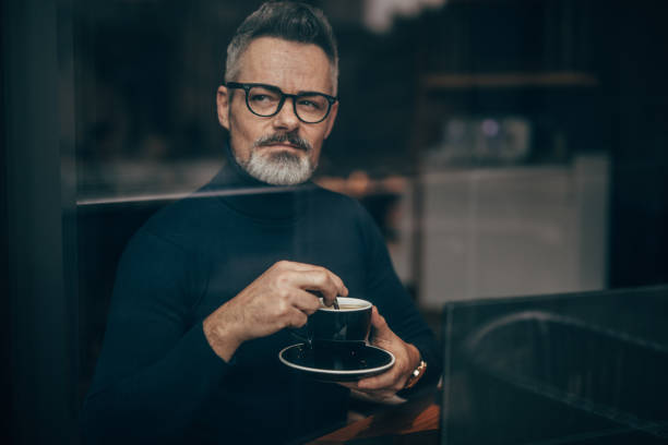 istock Mature man in the coffee shop 1127089925