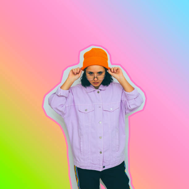 istock girl in sunglasses and orange hat on gradient background 1127090903