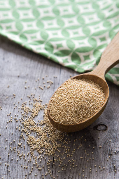 istock Amaranth seeds in a wooden spoon on table, selective focus. Raw Organic Amaranth Grain 1127091073