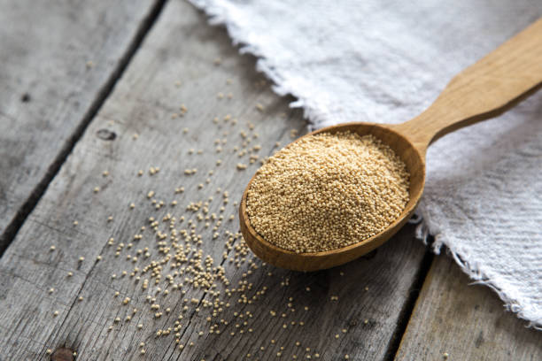 istock Amaranth seeds in a wooden spoon on table, selective focus. Raw Organic Amaranth Grain 1127091078