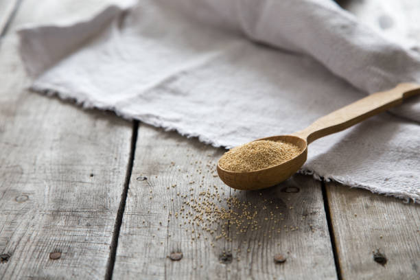 istock Amaranth seeds in a wooden spoon on table, selective focus. Raw Organic Amaranth Grain 1127091099