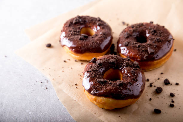 istock Pastries concept. Donuts with chocolate glaze and chocolate cookies 1127092536