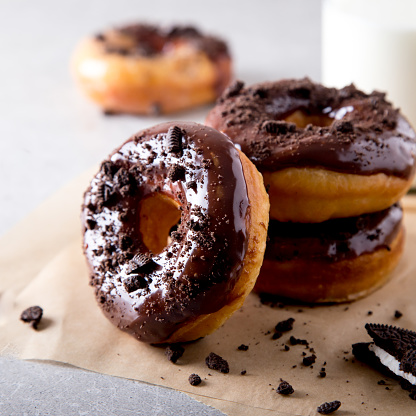Pastries concept. Donuts with chocolate glaze and chocolate cookies/
