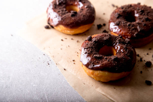 istock Pastries concept. Donuts with chocolate glaze and chocolate cookies 1127092671