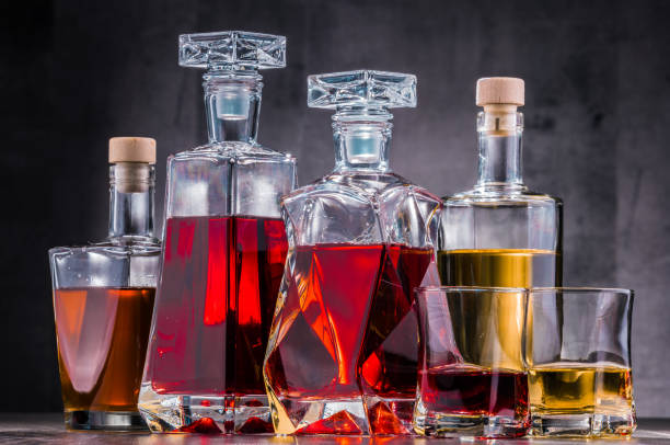 istock Carafe and bottles of assorted alcoholic beverages. 1127094135