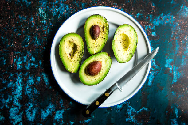 istock Overhead view of freshly prepared avocados 1127095228